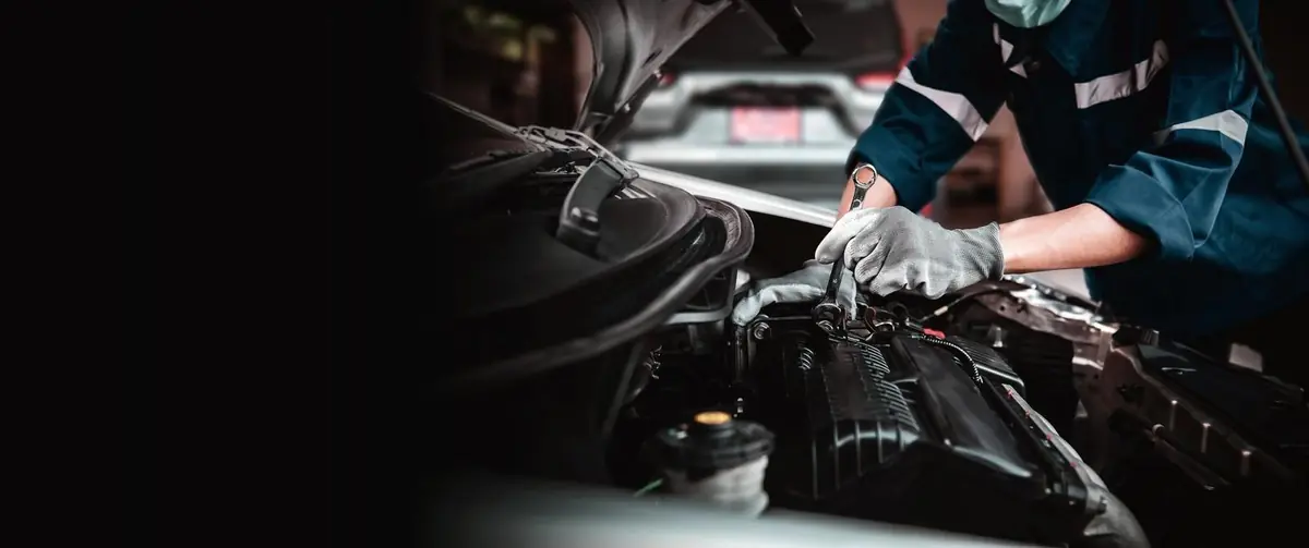 Technician working on an engine